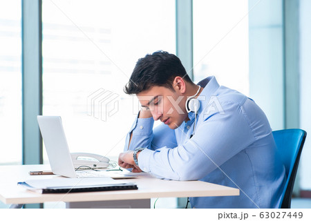Male call-center operator in business concept 63027449