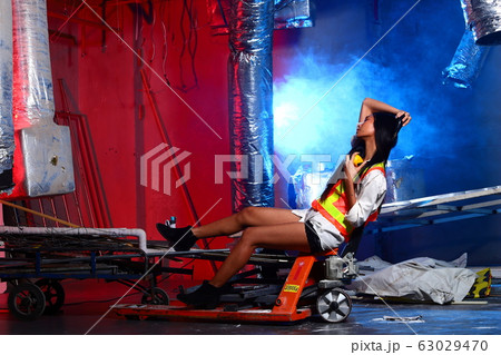 Beautiful Asian Architect Engineer woman in yellow 63029470