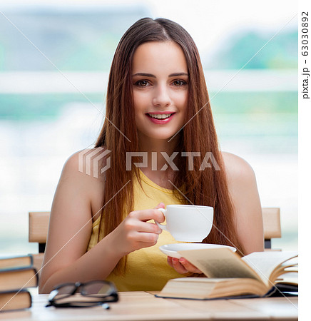 Young student preparing for exams drinking tea Young student preparing for exams drinking tea 63030892