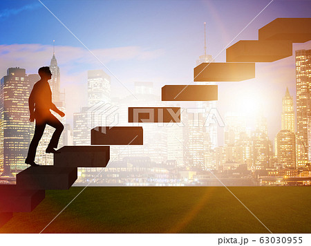 Businessman in career promotion concept with stairs 63030955