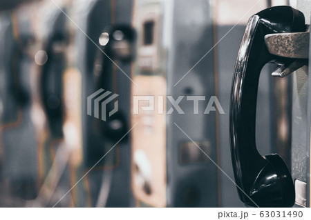 the public pay phone close up, phone and headset 63031490