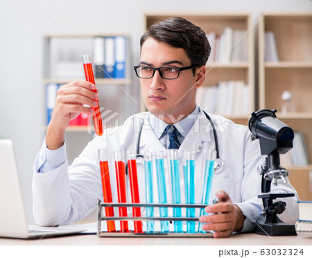Man doctor working in the lab Man doctor working in the lab 63032324