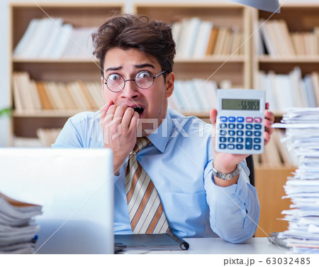 Funny accountant bookkeeper working in the office Funny accountant bookkeeper working in the office 63032485
