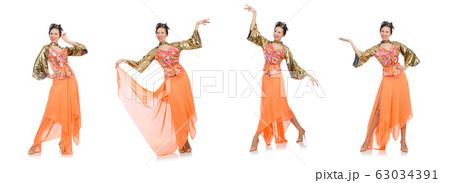 Woman in orange dress isolated on white 63034391