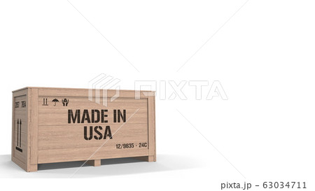 Large wooden crate with MADE IN USA text on white background. American industrial production related 3D rendering Large wooden crate with MADE IN USA text on white background. American industrial production related 3D rendering 63034711