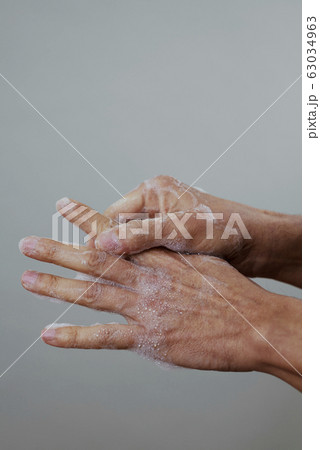 man washing his hands man washing his hands 63034963