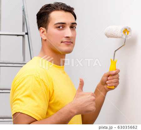 Young man doing home improvements Young man doing home improvements 63035662