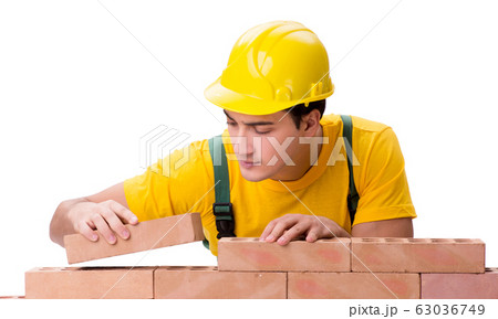 Handsome construction worker building brick wall Handsome construction worker building brick wall 63036749