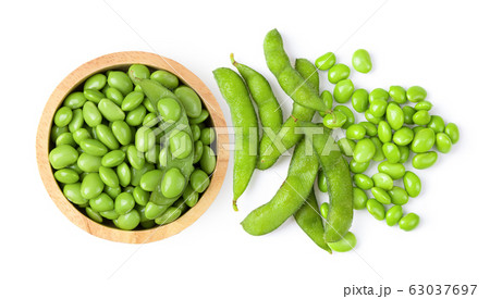 Green soy beans in wood bowl isolated on white Green soy beans in wood bowl isolated on white 63037697