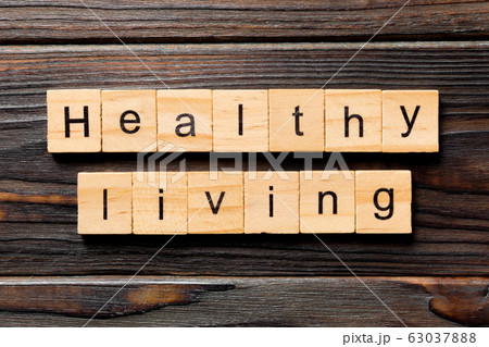 Healthy Living word written on wood block. Healthy Healthy Living word written on wood block. Healthy 63037888