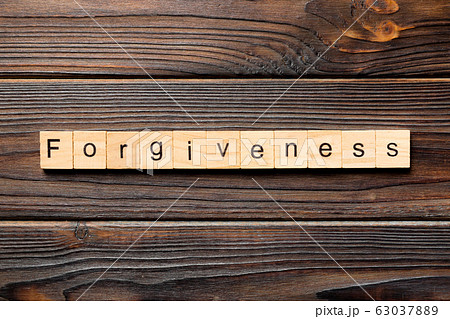 forgiveness word written on wood block. forgiveness word written on wood block. 63037889