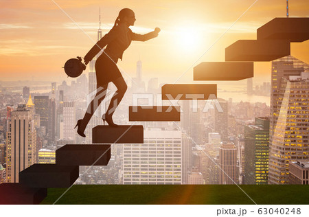 Businesswoman in career growth concept with stairs Businesswoman in career growth concept with stairs 63040248