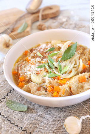 Italian food. Pancotto: bread soup with grated Parmesan cheese 63041416