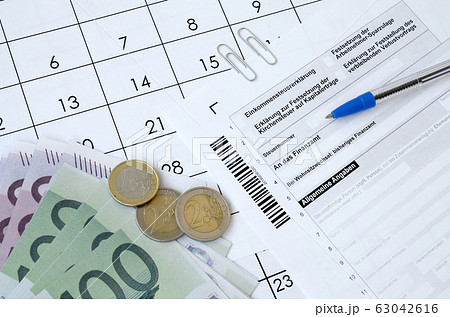 German tax form with pen and european money bills German tax form with pen and european money bills 63042616