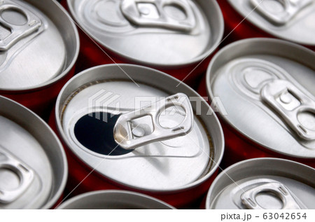 Many aluminium soda drink cans. Advertising for 63042654