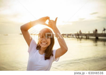 asian teenager sign heart shape by hand with asian teenager sign heart shape by hand with 63048536