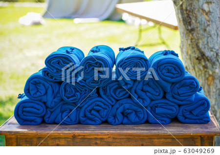 A set of warm blue rugs at an open-air party, in A set of warm blue rugs at an open-air party, in 63049269