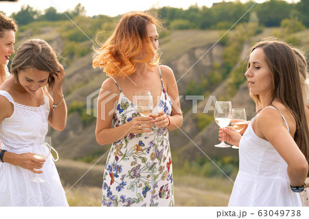 The company of gorgeous female friends having fun, 63049738