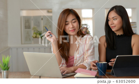 Close up view of two college girl preparing their Close up view of two college girl preparing their 63052600