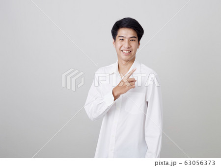 young asian handsome businessman on wall 63056373