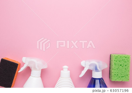 Spray for cleaning with lips on a pink background close-up. 63057196
