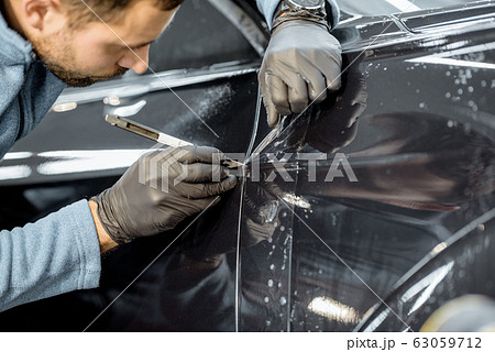 Filming car body at the vehicle service Filming car body at the vehicle service 63059712