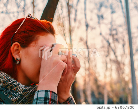 Person with camera in autumn. Person with camera in autumn. 63067800