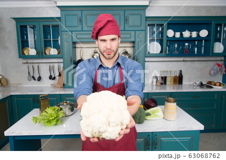 Man chef hold cauliflower cabbage vegetable in 63068762