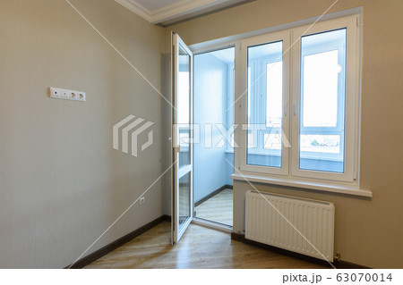 Exit to the balcony in an empty apartment after Exit to the balcony in an empty apartment after 63070014
