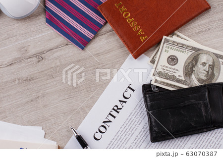 Contract, tie and passport. 63070387