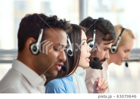 Young asian girl working as call center operator. Young asian girl working as call center operator. 63070646