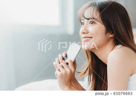 Beautiful woman wake up morning 63076663