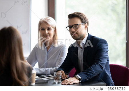 Diverse recruiter talk with business partner at office meeting 63083732