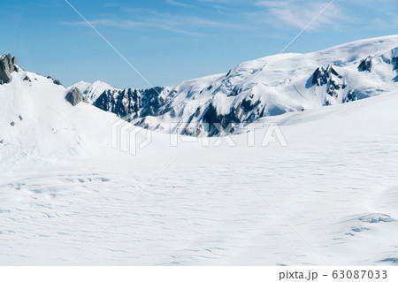 White clear snow covered black rock mountain 63087033