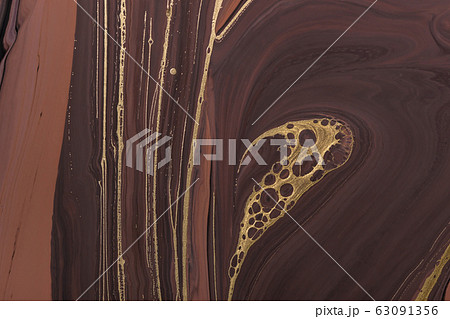Abstract Golden curl and lines on brown waves. 63091356