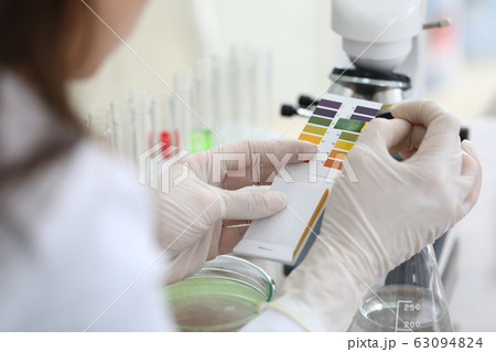 Researcher doing comparison 63094824