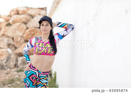 Female athlete near the white wall Female athlete near the white wall 63095874