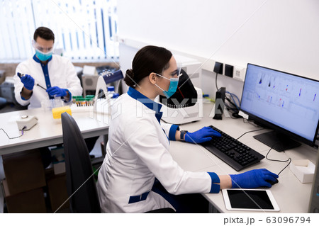 Young scientists doing tests and working on medical research Young scientists doing tests and working on medical research 63096794