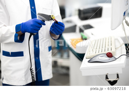 Male research scientist doing pathology blood test in lab 63097218