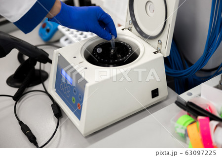 Research scientist doing biochemical blood test in lab 63097225
