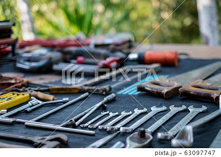 Photo top view a huge set collection of working hand and power tools many for the wooden on isolated black background 63097747
