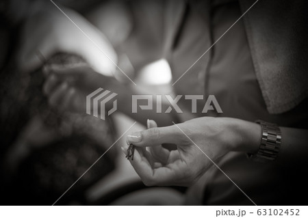 Hairdresser doing a woman's hair in monochrome 63102452