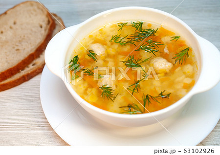 Chicken soup with meatballs and pasta on the table Chicken soup with meatballs and pasta on the table 63102926
