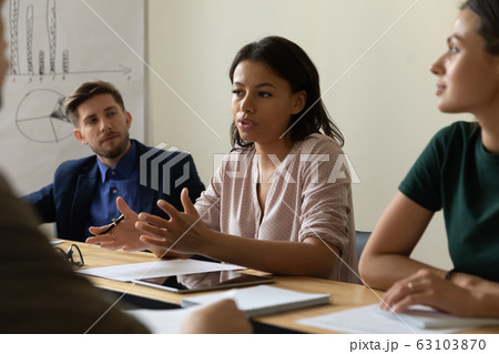 Multiracial colleagues brainstorm discuss ideas at briefing 63103870