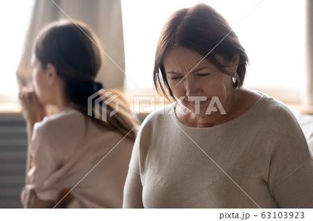 Unhappy senior mature mother feeling despair after quarrel. Unhappy senior mature mother feeling despair after quarrel. 63103923