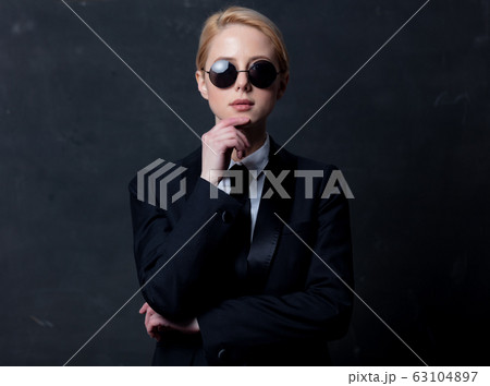 Style businesswoman in a classic black business Style businesswoman in a classic black business 63104897