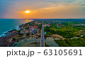 Sunset on the horizon over the highway 63105691