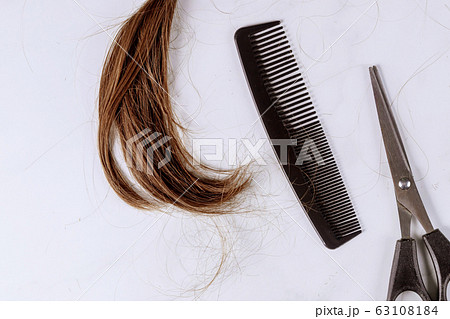 Cropped view a ponytail cutting hair for donation 63108184