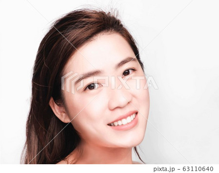 young beautiful asian woman with clean and bright skin, Cosmetic Beauty Concept,smiling face 63110640