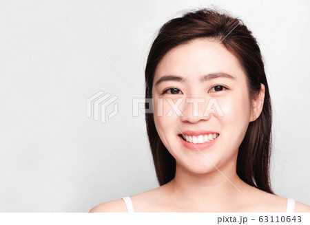 young beautiful asian woman with clean and bright skin, Cosmetic Beauty Concept,smiling face young beautiful asian woman with clean and bright skin, Cosmetic Beauty Concept,smiling face 63110643
